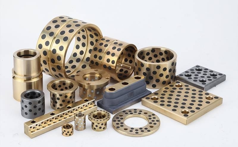 Como as buchas de bronze sinterizadas diferem das buchas de bronze fundidas?